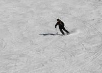 Graham speeds down the mountain to catch the last lift  - click for full size image